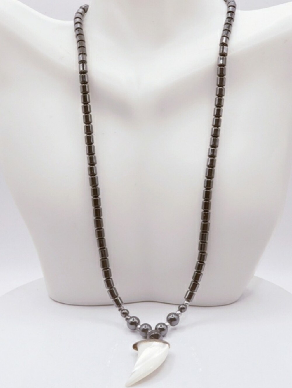 Hematite With Carved Mother Of Pearl Ivory Claw Pendant Necklace